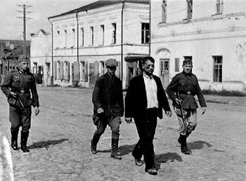 A German patrol caught two disguised Soviet soldiers. September 1941, Kiev, Ukraine..JPG
