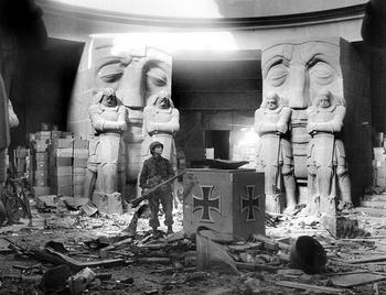 A U.S. soldier stands in the middle of rubble in the Monument of the Battle of the Nations in Leipzig after they attacked the city on April 18, 1945..jpg