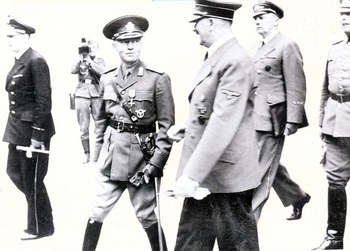 Adolf Hitler with Rumanian Marshal Ion Antonescu. In the background we can see Hitler's interpreter Gustav Paul Schmidt with General Wilhelm Keitel.jpg