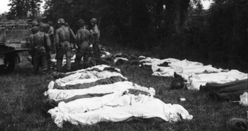 Bodies of U.S. soldiers are attended to in the French countryside, Summer 1944..jpg