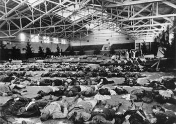 Bombing victims laid out in an exhibition hall, Autumn 1944.JPG