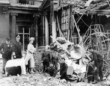 Churchill with King George VI and Queen Elizabeth inspecting the damage caused by bombs which hit Buckingham Palace at the beginning of the Blitz.jpg