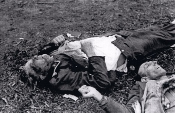 Dead SS soldier and another man at Dachau.jpg