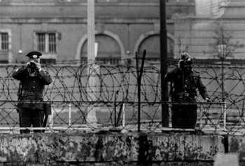 East German guards watching over the Berlin wall 1965.jpg