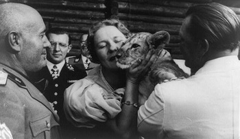 Göring and his wife Emmy showing off pet lion cub to Benito.jpg