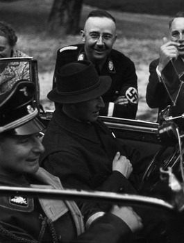 Heinrich Himmler looks on as Heydrich and Himmler's personal adjutant, Karl Wolff.jpg