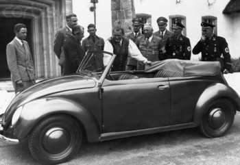 Hermann Goering stands next to a Volkswagen convertible at Carinhall hunting lodge, with Robert Ley and Ferdinand Porsche.jpg