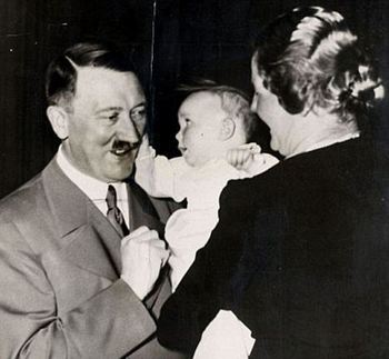 Hitler has his cheek pulled by Edda Goering.jpg