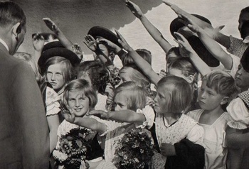 Hitler_with_a_group_of_young_girls_saluting_him.jpg