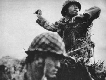 Japanese soldier throwing a Type 91 grenade, Guadalcanal,.jpg
