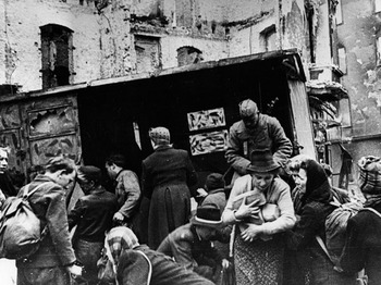Red Army soldiers distributing bread to Berlin residents after Germany’s surrender in 1945.jpg