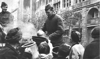 Soviet soldiers distributing hot food to Berlin women, 1945.jpg