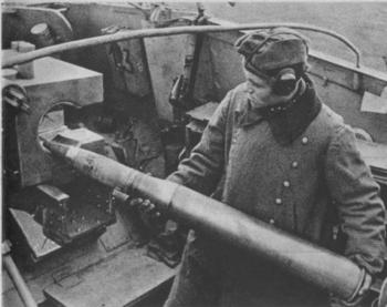 The crew is feeding the Nashorn's PaK 43 gun with an 88 mm (3.46 in) projectile.jpg